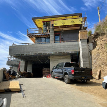 Contemporary Home with Board Formed Concrete and a Precast Cedar Fascia
