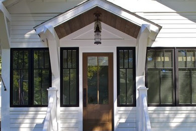Inspiration for a large craftsman white two-story wood house exterior remodel in Grand Rapids