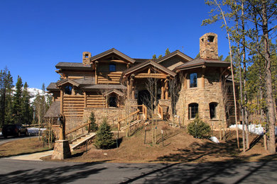 Example of a mid-sized arts and crafts beige three-story mixed siding gable roof design in Denver