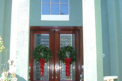 Mid-sized elegant ceramic tile double front door photo in Tampa with a dark wood front door