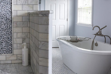 Large transitional master marble tile and gray tile marble floor and gray floor bathroom photo in Manchester with gray walls