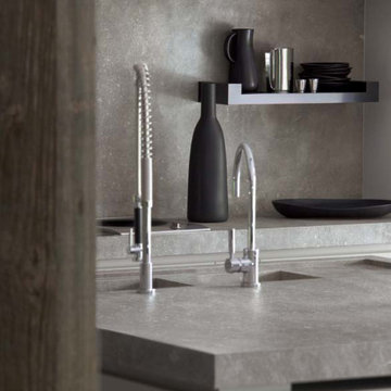Modern kitchen and dining room with grey porcelain tile