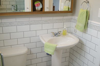 Small trendy master white tile and subway tile marble floor and gray floor doorless shower photo in Toronto with a pedestal sink, medium tone wood cabinets, gray walls and a two-piece toilet