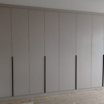 Modern Hinged Wardrobe with Backlights in Stanmore by Kudos Interior Designs