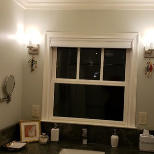 Example of a small classic kids' white tile and porcelain tile porcelain floor and white floor bathroom design in Atlanta with raised-panel cabinets, distressed cabinets, a two-piece toilet, green walls, an undermount sink, granite countertops and turquoise countertops
