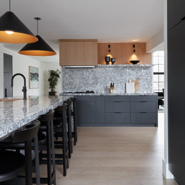 Modern Kitchen with Warm White Oak Range Hood & Wall Paneling