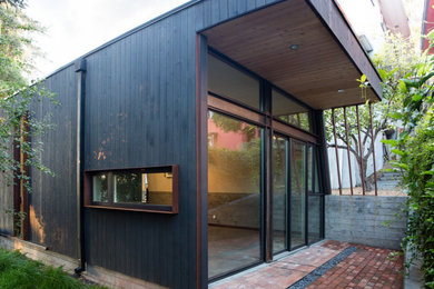 Example of a small minimalist black one-story flat roof design in San Francisco