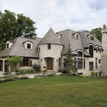 Stone and Stucco French Provincial Home with Random Width Grey and Purple Slate