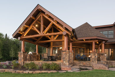 Rustic brown two-story wood house exterior idea in Detroit