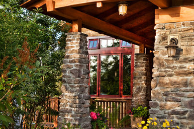 Arts and crafts two-story wood exterior home photo in Other