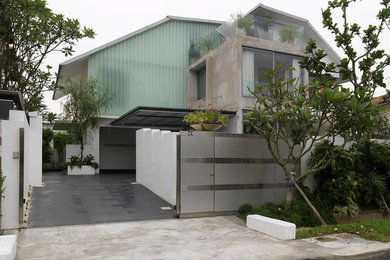 Inspiration for a mid-sized contemporary two-storey white exterior in Singapore.