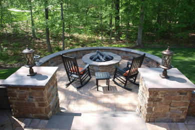 Patio - mid-sized traditional backyard brick patio idea in Richmond with a fire pit and no cover