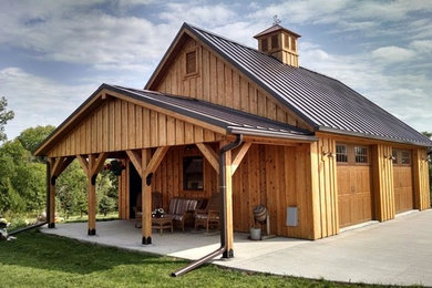 Inspiration for a mid-sized transitional detached two-car garage workshop remodel in Other