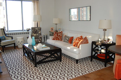 Example of a transitional living room design in New York