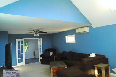 Large elegant open concept carpeted family room photo in Philadelphia with blue walls