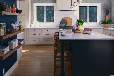 Eat-in kitchen - country medium tone wood floor, brown floor and exposed beam eat-in kitchen idea in San Francisco with quartz countertops, an island, a single-bowl sink, white backsplash, quartz backsplash, gray countertops and stainless steel appliances