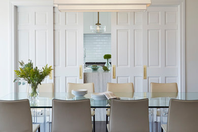 Enclosed dining room - transitional enclosed dining room idea in Chicago with white walls