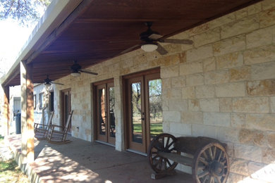 Rustic exterior home idea in Austin