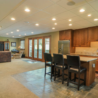 Photo of a medium sized traditional walk-out basement in Chicago with green walls and slate flooring.