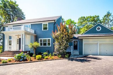Large elegant blue three-story wood exterior home photo in Boston with a shingle roof