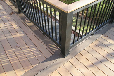 Deck - tropical backyard deck idea in St Louis