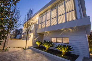 This is an example of a mid-sized beach style home design in Perth.