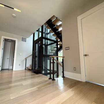 Project #136 | Modern Floating Staircase Encircling Glass Elevator