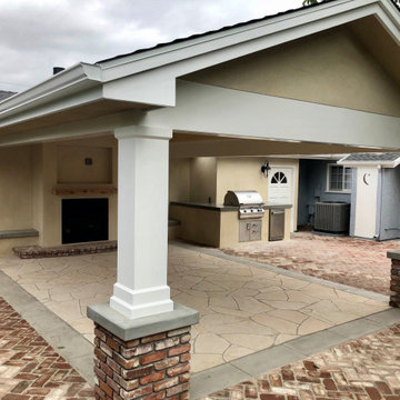 Patio Cover attached to the house with brick columns, flagstone and brick paving