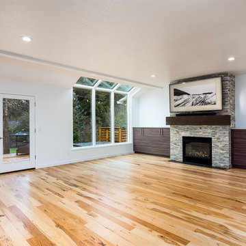 Complete home remodel with custom IKEA storage and relocation of fireplace