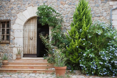 This is an example of a mid-sized full sun front yard stone landscaping in San Francisco.