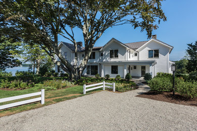 White two-story wood house exterior photo in New Orleans with a shingle roof