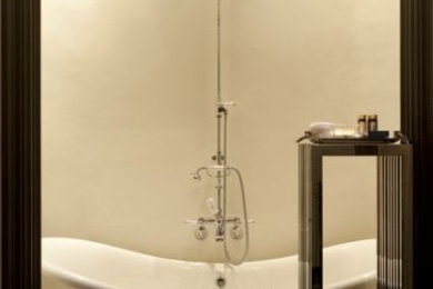 Example of an ornate limestone floor bathroom design in Other