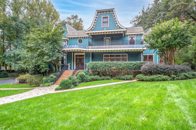 Large victorian blue two-story wood and clapboard house exterior idea in Richmond with a gray roof and a tile roof