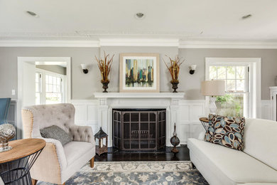 Mid-sized elegant formal and open concept dark wood floor and brown floor living room photo in Detroit with gray walls, a standard fireplace and a wood fireplace surround