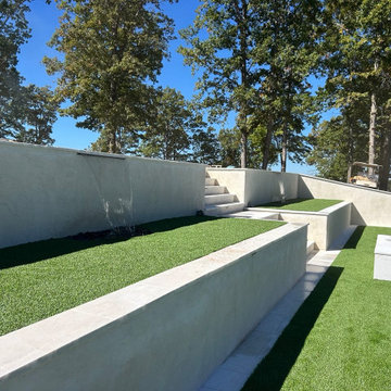 Contemporary Pool and Spa Installation Featuring Cool Blue Hollow Lime Turf