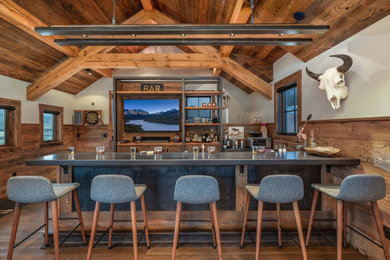 Inspiration for a rustic home bar remodel in Other