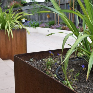 Back patio and steps with corten steel planters