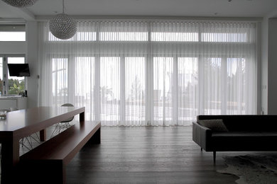 Inspiration for a mid-sized modern formal dark wood floor living room remodel in Vancouver