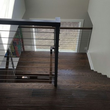 Open riser stairs with stainless steel cable wire railing