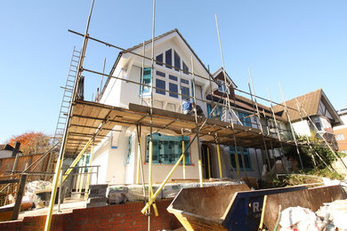 This is an example of a medium sized contemporary house exterior in Hampshire.