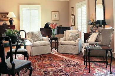 Inspiration for a mid-sized traditional formal living room in Charlotte with beige walls and carpet.