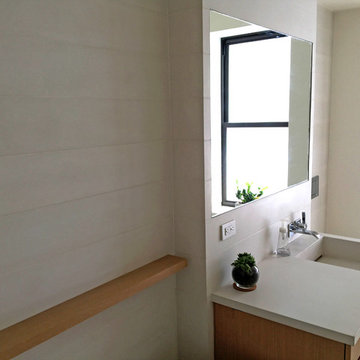 Concrete bathroom finishes - tiles, floor, sink.Private residence - Manhattan.
