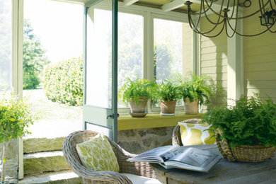 Example of a beach style sunroom design in Portland Maine