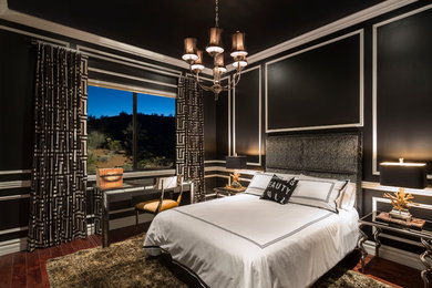 Inspiration for a mid-sized contemporary guest medium tone wood floor bedroom remodel in Phoenix with black walls and no fireplace