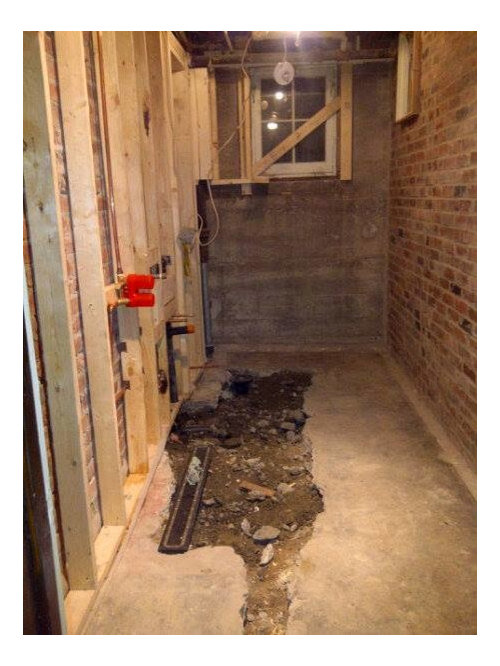 Red Brick Wall In Basement Shower, Why Do Old Houses Have Showers In The Basement