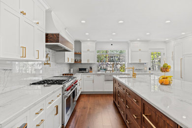 Inspiration for a huge transitional dark wood floor kitchen remodel in Los Angeles with an integrated sink, shaker cabinets, quartzite countertops, quartz backsplash, an island and white countertops