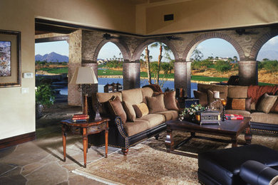 Tuscan open concept living room photo in Orange County