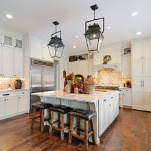brick backsplash and white springs granite