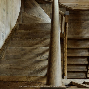 Photography of wooden stairs installed in a log house near Vilnius.