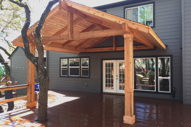 Mid-sized arts and crafts backyard patio kitchen photo in Austin with decking and a gazebo
